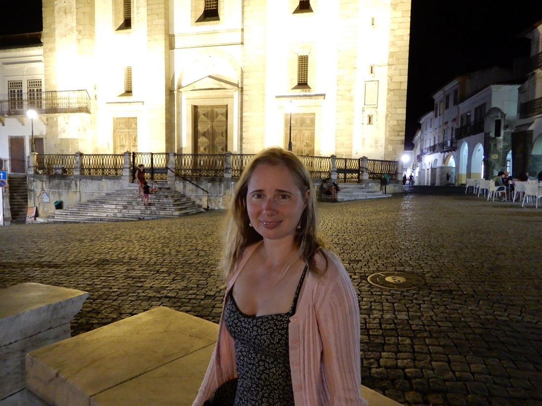 Elena,with lighted building in background