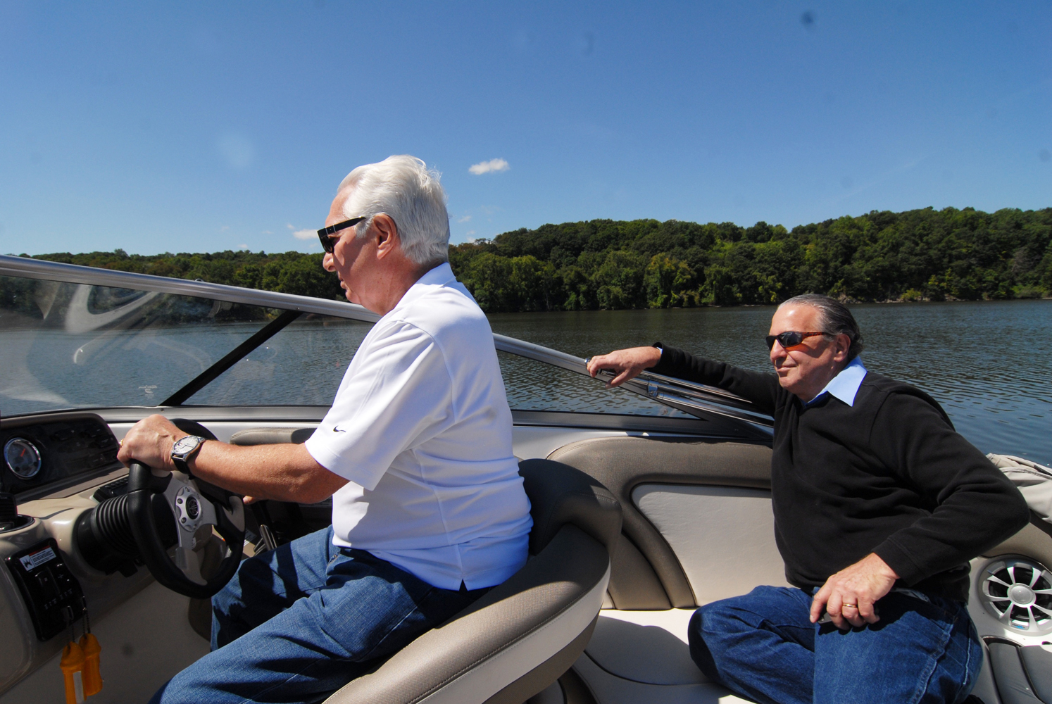 Alan Gosule (at the wheel) with Jon in back enjoying the ride on Alan's boat on the Hudson River in 2014.