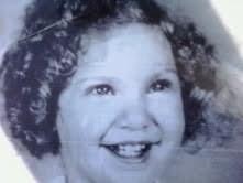 Liza smiling face as a very young child 